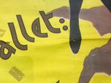 a yellow poster with a picture of a woman on it