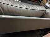 a bed that has a mattress on top of it