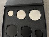 a black box with four different shades of eyeshadow in it