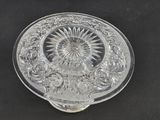 an image of a clear glass plate with a flower design on it