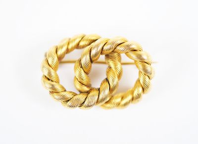 a close up of a gold ring on a white surface