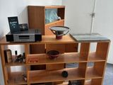 a wooden shelf with a laptop on top of it