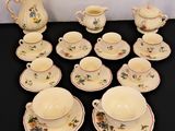 a lot of tea cups and saucers on the table
