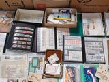many boxes of stamps and other items on a table