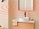 a bathroom with a sink and a mirror on the wall