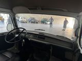 a view from inside of a van of a man walking