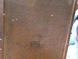 a wooden cabinet that is sitting on the floor