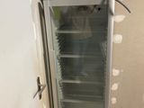 an image of a refrigerator that is in a room