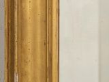 a mirror that is sitting on a shelf in a room