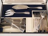 a box with silverware in it on a table