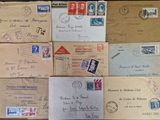many old envelopes on the table with stamps on them