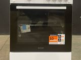 a white stove that has a price tag on it