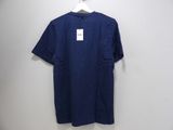 a blue t - shirt hanging on a hanger on a wall