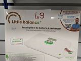 a little balance scale on the shelf in the store
