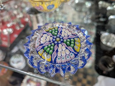a glass table with a glass bowl on top of it