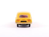 a yellow toy car that is sitting on a white surface