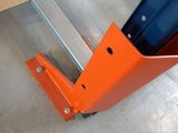 a blue and orange piece of equipment on the floor