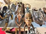 many different types of african masks on a table