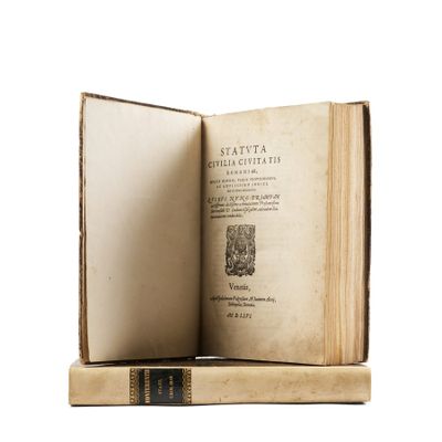 an old book opened to reveal a page of text on a white background