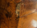a close up of a wooden box on a table