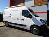 a white van that is parked in front of a building