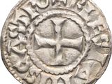 Gros plan sur une pièce de monnaie portant une croix