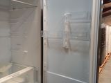 an open refrigerator with the door open in a room