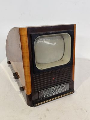 a small television sitting on top of a wooden stand