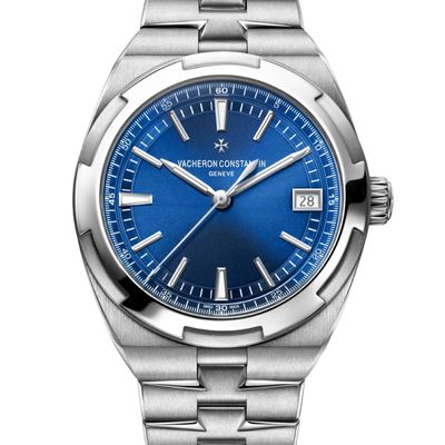 a close up of a watch on a white background with a blue dial