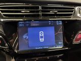 a picture of a car dashboard with a cell phone on it