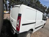 a white van that is parked on the side of the road