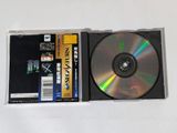a cd that is sitting on a white table