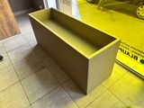 a box that is sitting on the floor in front of a window