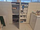 an image of a kitchen with a refrigerator and a pantry