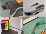 four different pictures of a guitar, a nintendo wii controller, a nintendo wii controller, and a nintendo wii controller