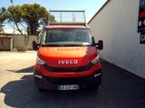 a red van parked in front of a white building