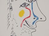 an image of a drawing of a man ' s face with a red dot on his nose