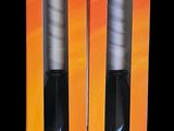 pair of black and white toothbrushes in packaging on a black background