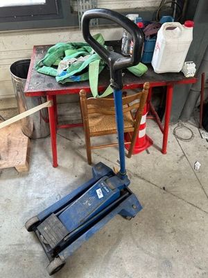 a small table with tools on it in a garage