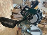 someone is using a circular saw to cut a piece of wood