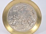 pair of silver and gold plate with a picture of a man and woman in a landscape