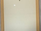 painting on the wall of a room with a clock on the wall