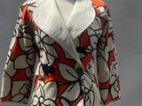 a white mannequin with a red and white jacket on it