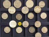 a lot of coins that are in a black case