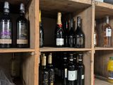 many bottles of wine on the shelves in the store