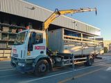 a white truck with a crane on the back of it