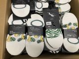 many pairs of white and green socks in a box