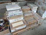 many boxes of books on a table in a room