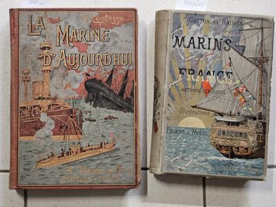 two books sitting on top of a table next to each other