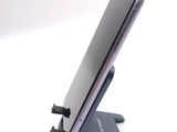a cell phone that is sitting on top of a stand